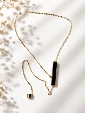 Elegant Gold and Black Necklace